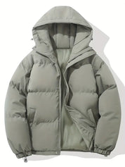 Giacca invernale imbottita grigia con cappuccio, design trapuntato, chiusura a zip, ideale per climi freddi. Moda uomo, abbigliamento outdoor.