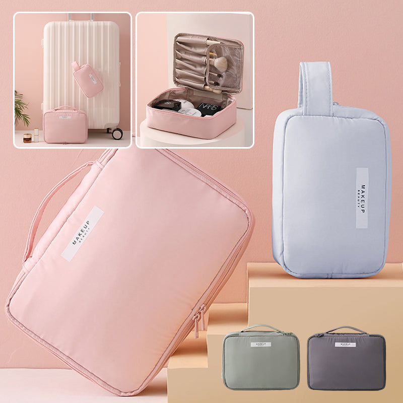 Set di borse da viaggio organizer in tessuto rosa e grigio, ideali per cosmetici e accessori. Design compatto, perfetto per valigie e bagagli a mano.
