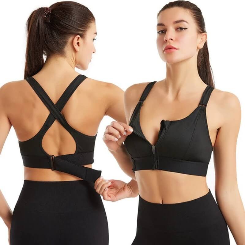 Due donne indossano reggiseni sportivi neri con chiusura frontale e schiena incrociata. Abbigliamento fitness, supporto allenamento, moda sportiva.