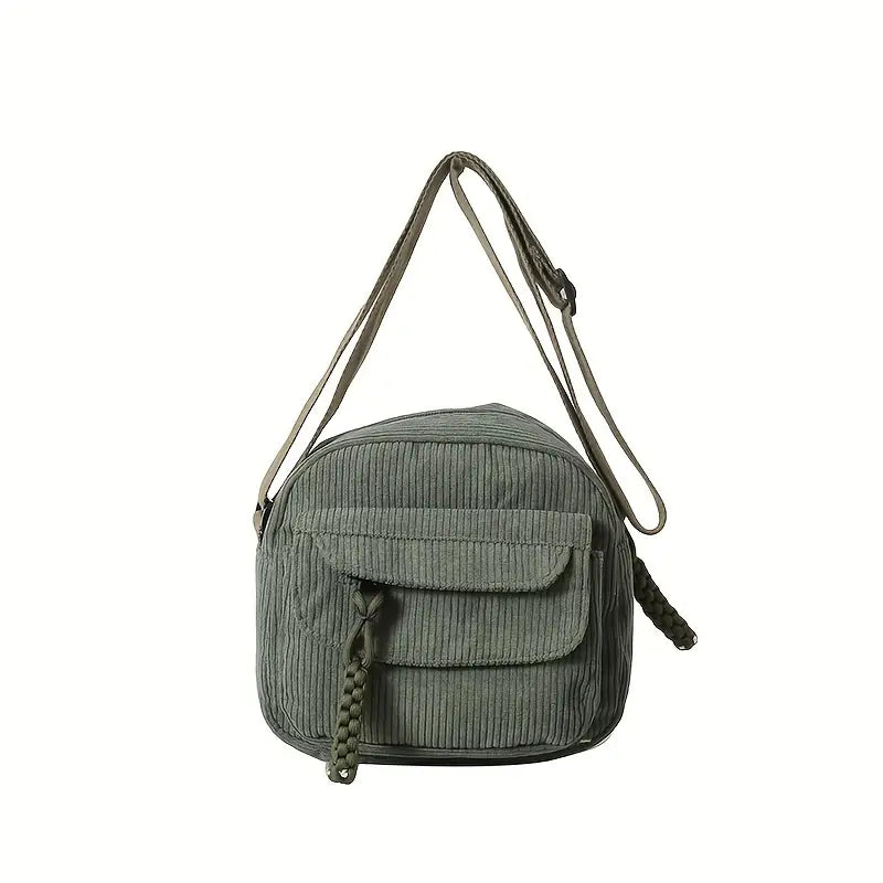 Borsa a tracolla verde in velluto a coste con tasca frontale e tracolla regolabile. Design casual, ideale per uso quotidiano e moda urbana.