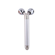 Rullo massaggiante viso 3D in acciaio inox, design ergonomico, doppia sfera rotante, per lifting e tonificazione pelle, cura del viso e bellezza.
