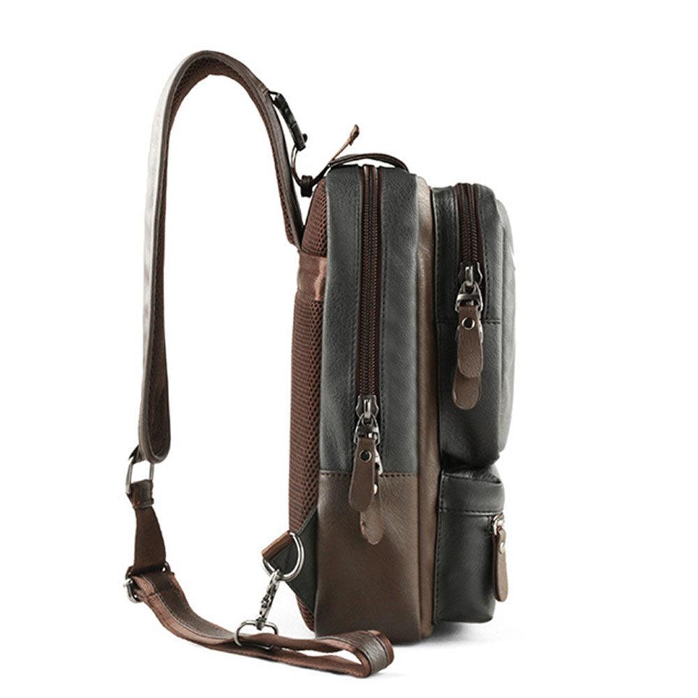 Zaino a tracolla in pelle marrone e nera, design compatto con doppie cerniere, ideale per uomo, moda casual, accessorio versatile e resistente.
