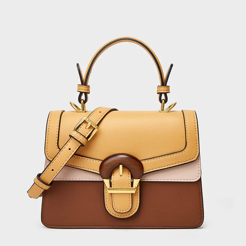 Borsa a mano in pelle multicolore con fibbia dorata, manico superiore e tracolla regolabile. Design elegante e moderno, perfetto per ogni occasione.