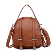Zaino in pelle marrone elegante con manico superiore e tracolla regolabile, design moderno, ideale per moda donna, accessori di tendenza.