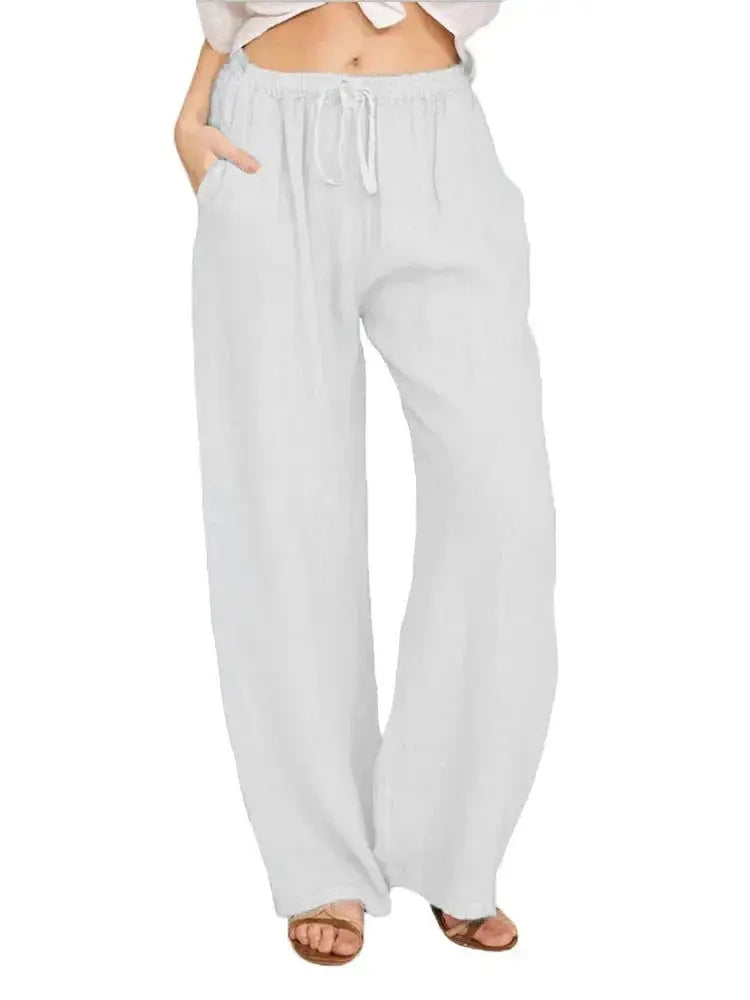 Pantaloni larghi bianchi da donna, vita alta con laccio, tasche laterali, tessuto leggero e traspirante, perfetti per l'estate e il tempo libero.