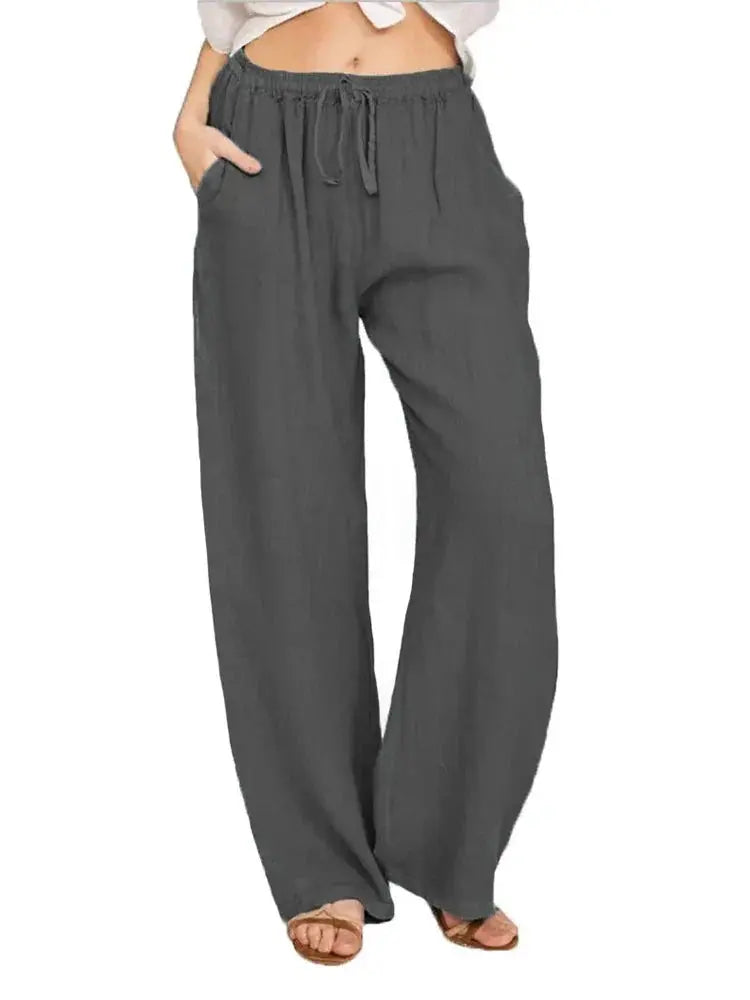 Pantaloni larghi donna in lino grigio, vita alta con coulisse, tasche laterali, stile casual estivo.