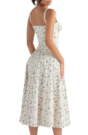 Abito estivo donna, lungo, bianco con stampa floreale verde, spalline sottili, stile vintage, perfetto per occasioni casual e eleganti.