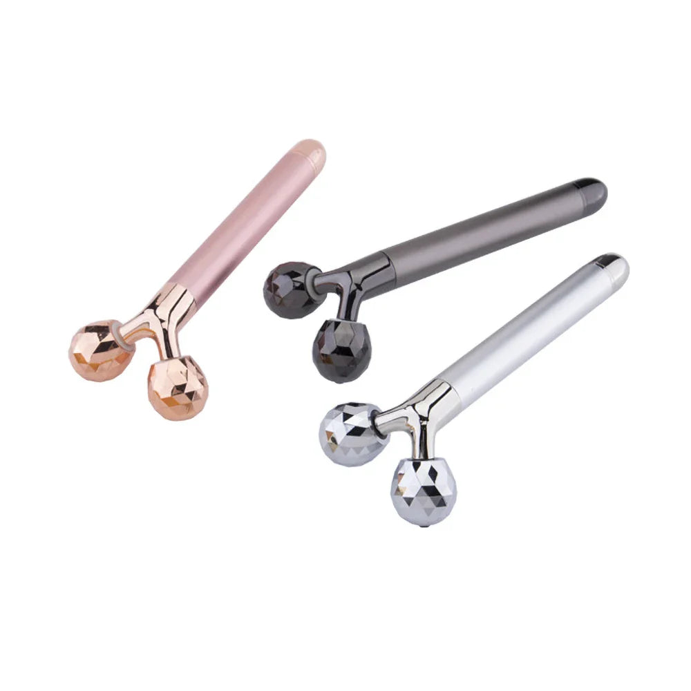 Tre massaggiatori facciali a rullo 3D in colori rosa, grigio e argento, ideali per tonificare e rassodare la pelle. Accessori bellezza viso.