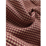 Tessuto a quadretti bordeaux e beige, motivo classico, ideale per abbigliamento e arredamento, texture morbida e resistente.