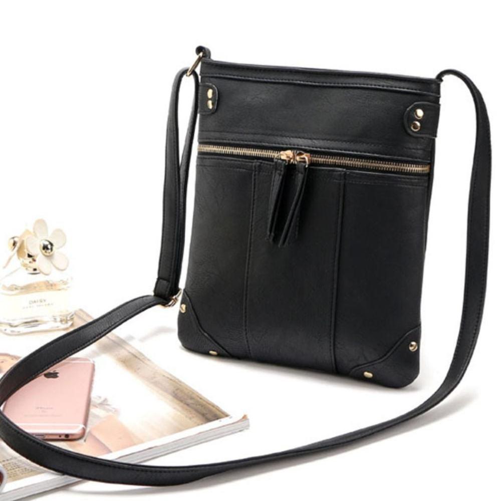 Borsa a tracolla nera in pelle con zip dorate, design elegante, ideale per donna. Accessorio moda versatile, perfetto per ogni occasione.