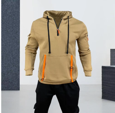 Felpa beige con cappuccio e zip, dettagli arancioni, tasche frontali, cordini neri, stile casual, ideale per moda uomo autunno-inverno.