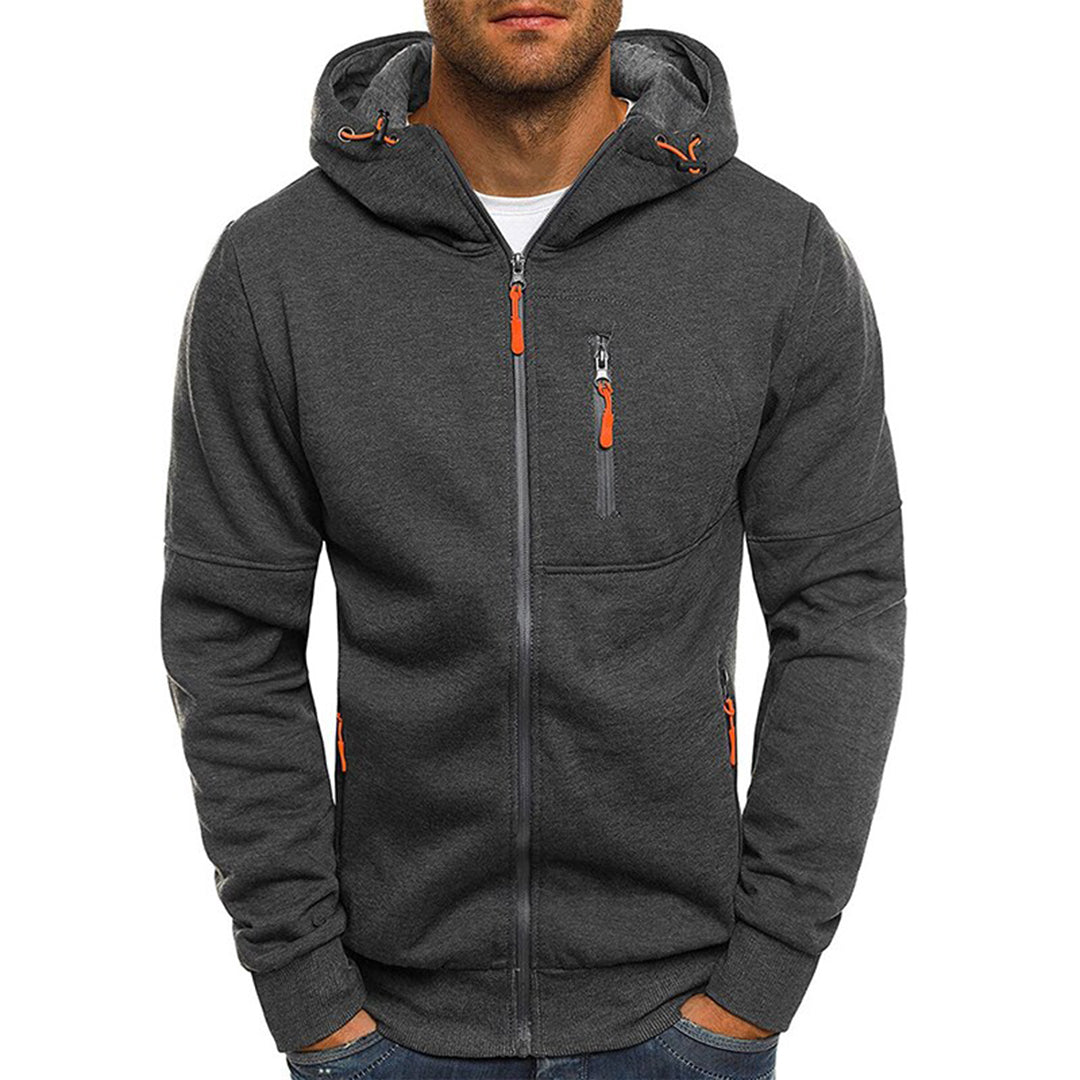 Felpa con cappuccio grigia da uomo, zip frontale, tasche con cerniera arancione, design casual, ideale per abbigliamento sportivo e tempo libero.