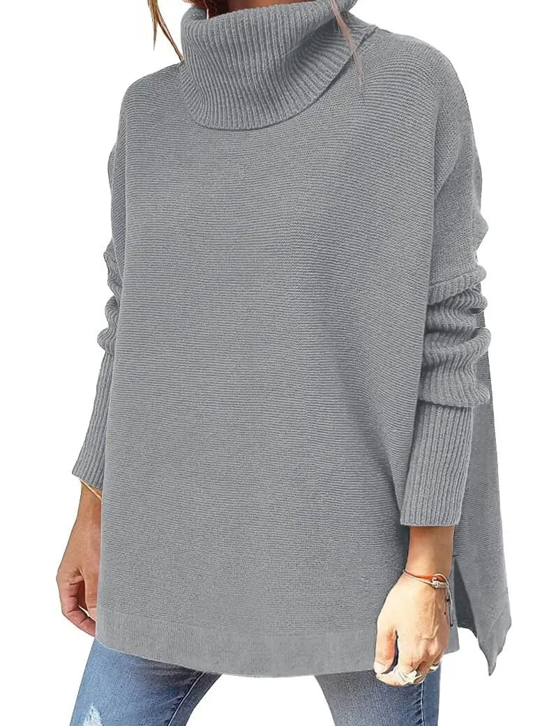 Maglione donna grigio a collo alto, maniche lunghe, stile casual, tessuto morbido, ideale per autunno e inverno, abbinato a jeans.