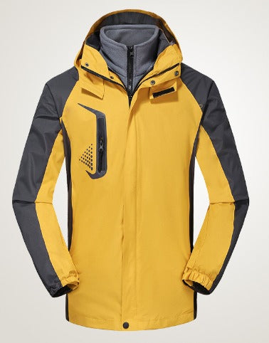 Giacca impermeabile da uomo gialla e grigia con cappuccio, antivento, ideale per escursioni e attività outdoor. Design moderno e funzionale.