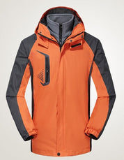Giacca da sci arancione e grigia, impermeabile, con cappuccio e tasca frontale, ideale per sport invernali. Design moderno e funzionale.