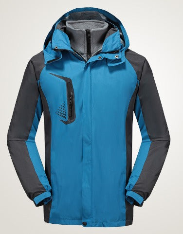 Giacca impermeabile da uomo blu e grigia con cappuccio, tasca con zip, ideale per escursioni e attività outdoor. Design sportivo e resistente.