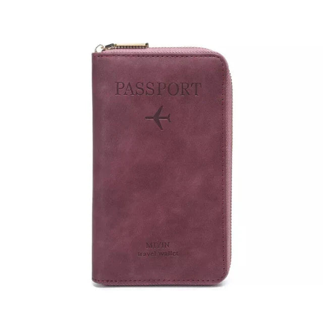 Portafoglio da viaggio in pelle rosa con cerniera, design per passaporto, logo aereo inciso, ideale per organizzare documenti e carte.