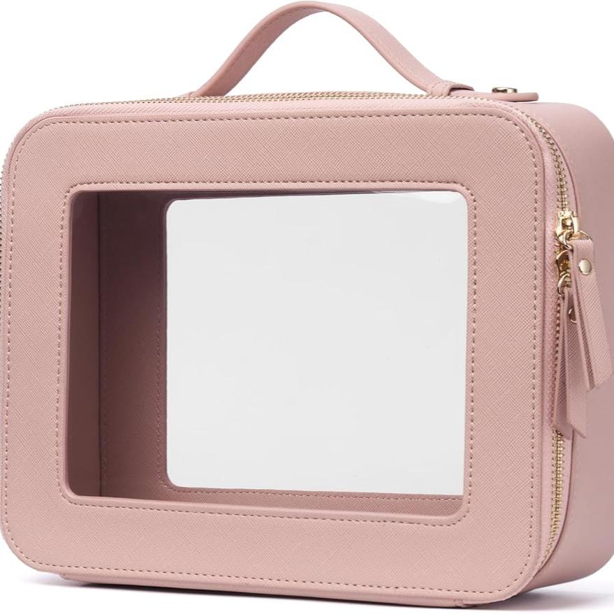 Astuccio da viaggio rosa con finestra trasparente, cerniera dorata e manico. Ideale per cosmetici. Design elegante e funzionale.