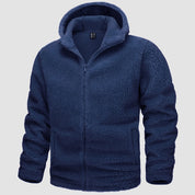 Giacca in pile blu con cappuccio, chiusura a zip, tasche frontali. Abbigliamento invernale caldo e morbido. Perfetto per outdoor e casual.