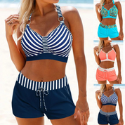 Costume da bagno donna a righe blu e bianche, con top e pantaloncini coordinati. Disponibile in vari colori. Perfetto per la spiaggia.