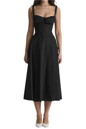Abito nero elegante donna, lunghezza midi, spalline sottili, scollo a cuore, perfetto per serate e occasioni speciali.