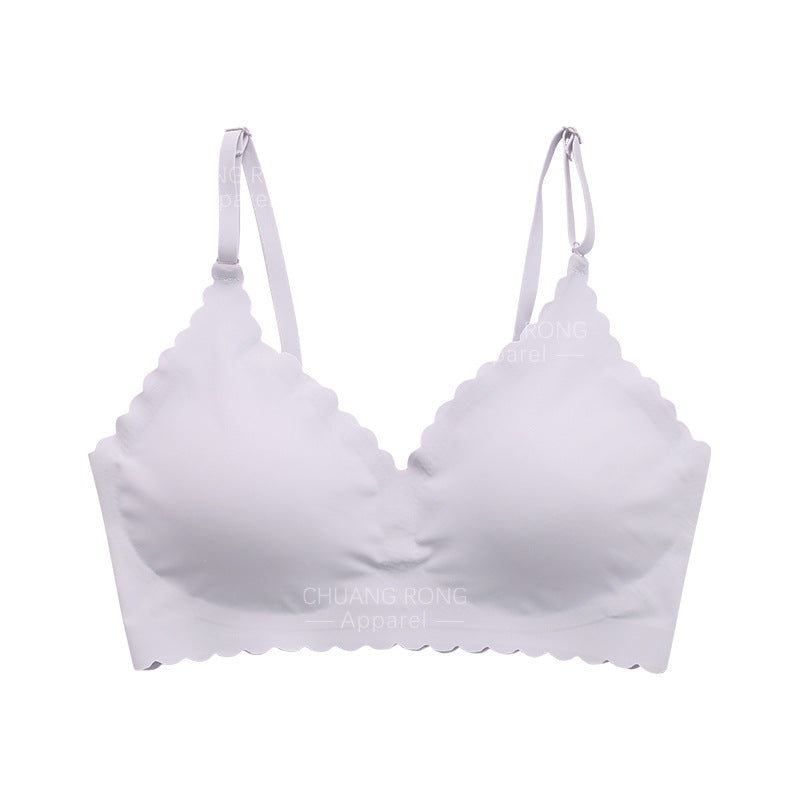 Reggiseno bianco senza cuciture con spalline regolabili, design a bordo ondulato, comfort quotidiano, intimo donna elegante e moderno.
