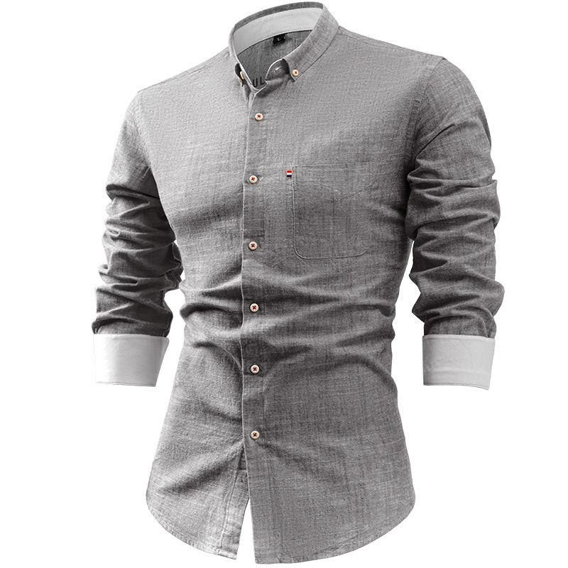 Camicia uomo grigia a maniche lunghe, design elegante, bottoni bianchi, colletto classico, ideale per abbigliamento casual e formale.