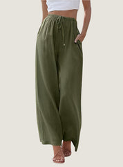 Pantaloni larghi donna verde oliva, vita alta con coulisse, tasche laterali, tessuto leggero. Ideali per look casual estivi.