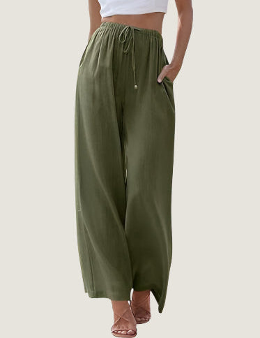 Pantaloni larghi donna verde oliva, vita alta con coulisse, tasche laterali, tessuto leggero. Ideali per look casual estivi.
