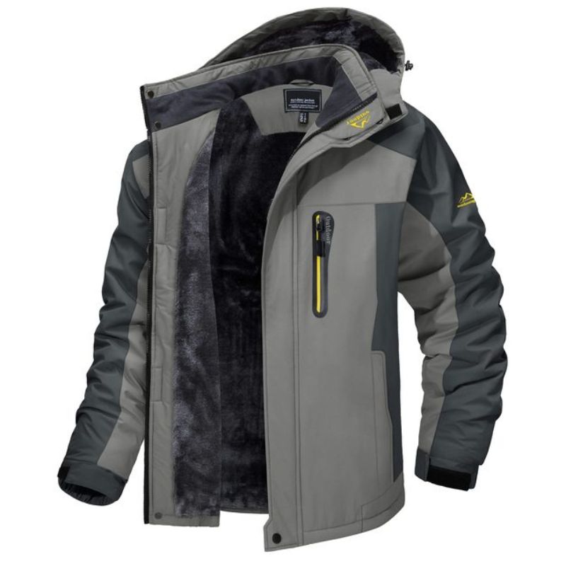 Giacca invernale da uomo grigia con cappuccio, interno in pelliccia sintetica, tasca con zip, design sportivo, ideale per escursioni e attività all'aperto.