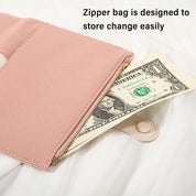 Borsetta rosa con cerniera, ideale per conservare monete e banconote. Design elegante e pratico per l'organizzazione quotidiana.