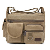 Borsa a tracolla in tela beige con tasche multiple e cerniere, design unisex, ideale per viaggi e uso quotidiano. Accessorio moda pratico e resistente.