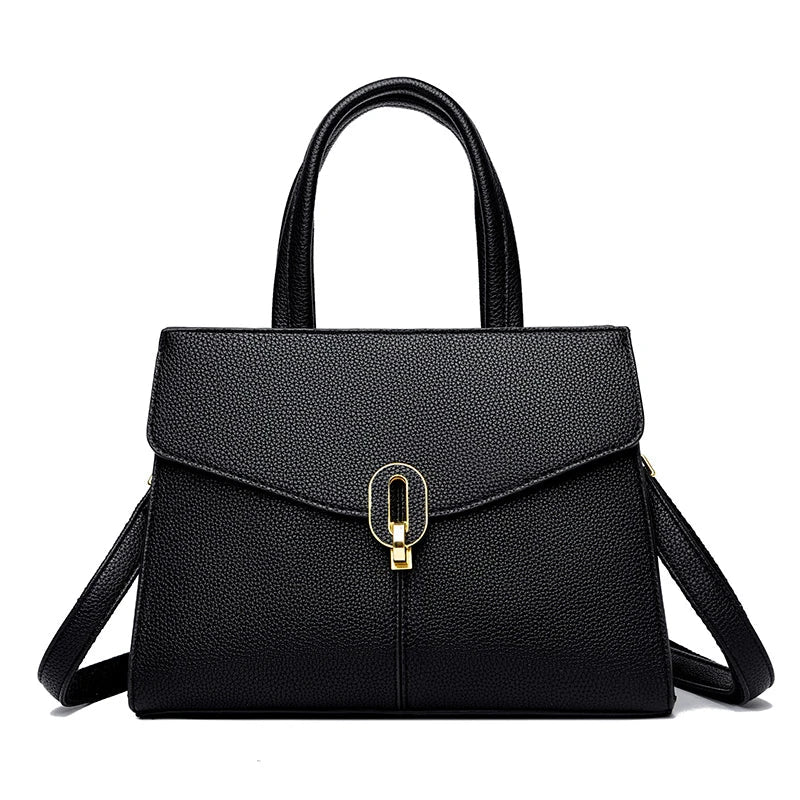 Borsa a mano in pelle nera elegante con chiusura dorata, design moderno, doppio manico, ideale per moda donna e accessori di lusso.