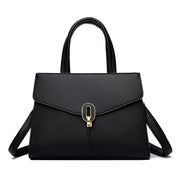 Borsa a mano in pelle nera elegante con chiusura dorata, design moderno, doppio manico, ideale per moda donna e accessori di lusso.