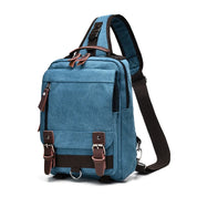 Zaino monospalla in tela blu con dettagli in pelle marrone, tasche multiple e cinghia regolabile. Design casual e pratico per uomo e donna.