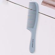 Pettine grigio in plastica per capelli, design ergonomico, denti larghi, ideale per districare e styling, accessorio essenziale per parrucchieri.