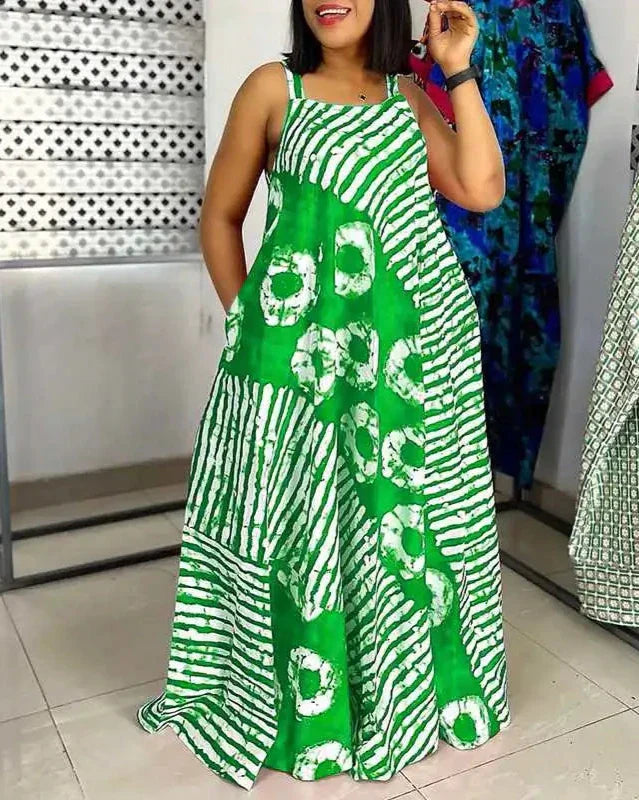 Abito lungo estivo verde con motivo a righe e cerchi bianchi, senza maniche, ideale per moda donna casual e occasioni estive.