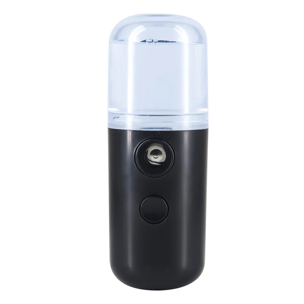 Nebulizzatore portatile nero, design compatto, con serbatoio trasparente. Ideale per idratazione viso, skincare, ricaricabile USB.
