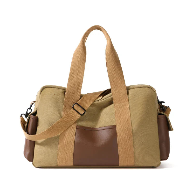 Borsa a tracolla in tela beige e marrone, design elegante e funzionale, ideale per viaggi e uso quotidiano. Tasche multiple, stile casual chic.