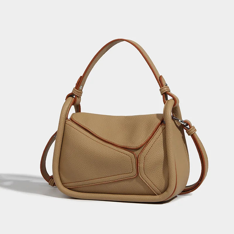 Borsa a tracolla in pelle beige, design moderno e geometrico, manico regolabile, ideale per moda donna, accessorio elegante e versatile.