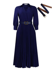 Abito lungo blu scuro con cintura in vita, maniche lunghe e gonna plissettata. Include cintura intercambiabile marrone. Elegante e versatile.