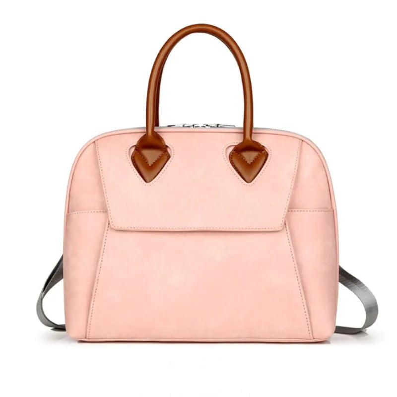 Borsa a mano donna in pelle rosa, design elegante con manici marroni, ideale per moda femminile e accessori di lusso.