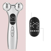 Dispositivo massaggio viso argento con sfere rotanti, display LED e pulsanti. Strumento bellezza per lifting e tonificazione pelle.