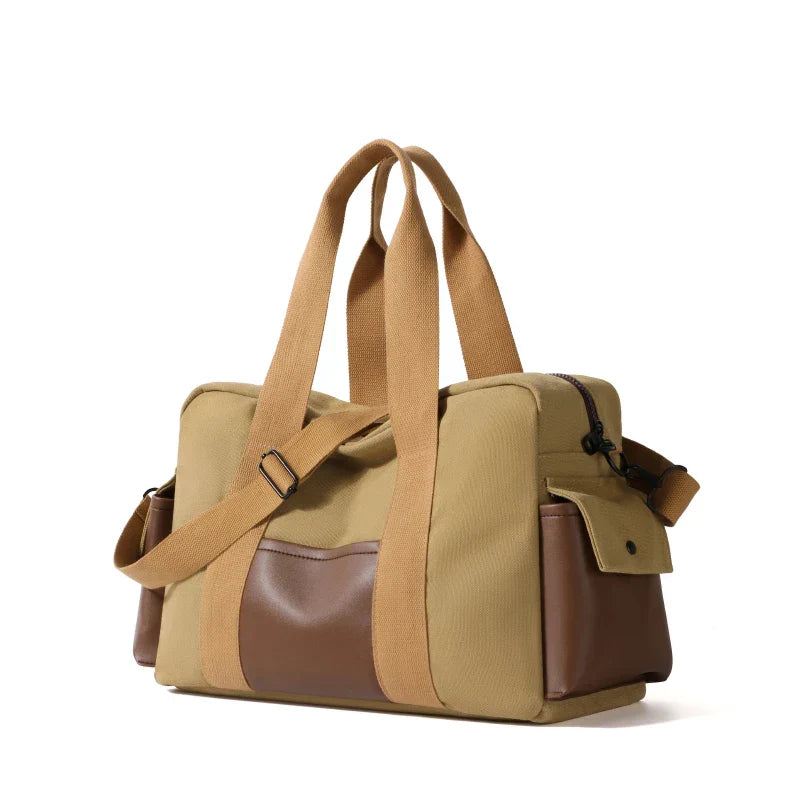 Borsa a tracolla in tela beige e marrone, design elegante e funzionale, con tasche laterali e manici robusti. Accessorio moda versatile per ogni occasione.