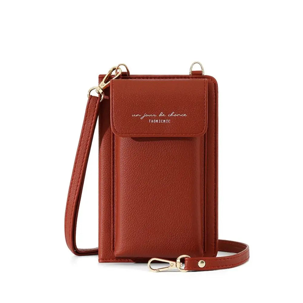 Custodia per cellulare in pelle marrone con tracolla regolabile, tasca frontale e chiusura a bottone. Accessorio moda elegante e funzionale.