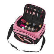 Borsa trucco professionale rosa e nera con pennelli, cosmetici e accessori organizzati. Ideale per viaggi e make-up artist.