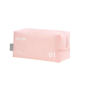 Astuccio da viaggio rosa in tessuto impermeabile, con cerniera e scritta "Have a Good Trip". Ideale per cosmetici e accessori.