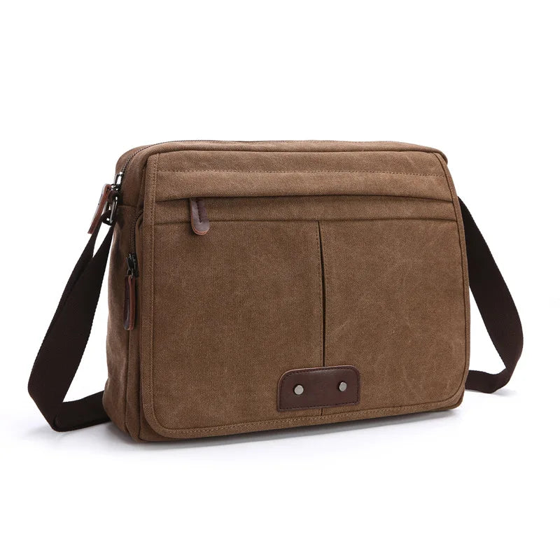 Borsa a tracolla in tela marrone, design casual, con tasche frontali e cinghia regolabile. Ideale per uomo e donna, perfetta per uso quotidiano.