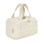 Borsa a mano beige in tessuto trapuntato con doppia zip e manici, design elegante e spazioso, ideale per moda femminile e viaggi.