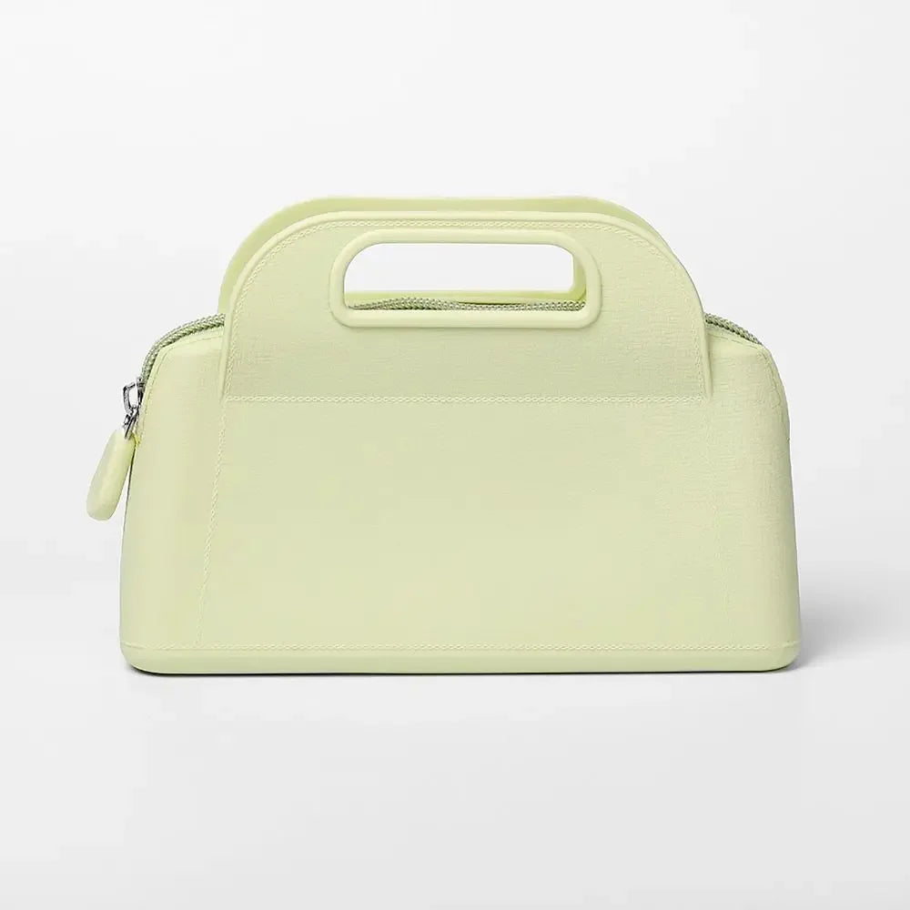 Borsa a mano in pelle verde chiaro con manico integrato, design elegante e moderno, perfetta per moda donna, accessorio di lusso.